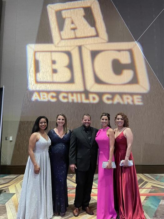 A photo of the ABC Child Care team at an event
